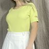 Elegantiška trikotažinė palaidinė geltonos spalvos